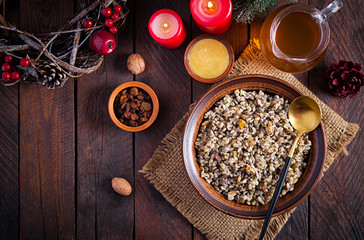 Kutya. Christmas porridge made of wheat grains, poppy seed, nuts, raisins and honey. Christmas kutia. Ukrainian cuisine. Top view, overhead