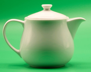 teapot on green background
