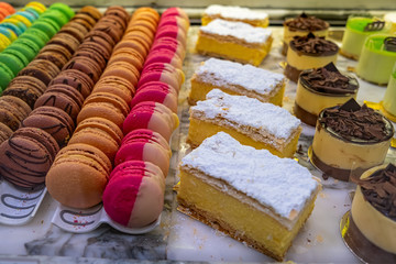Various types of sweet dessert at a cafe - closeup with shallow focus