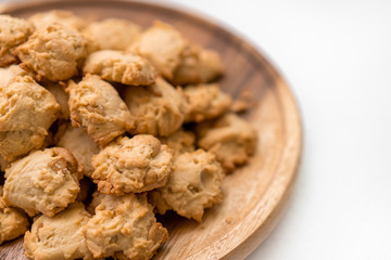 Cashews cookies on wooden plate isolate on white background.
