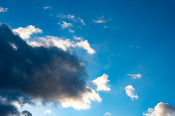 Blue sky with black clouds. Blue sky with white clouds