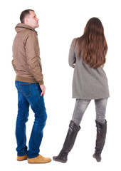 Back view of couple in winter jacket.