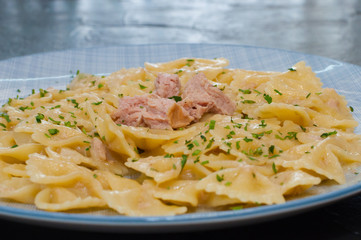 Delicious traditional Italian food. Pasta tuna, cheese and spices