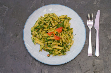 Delicious traditional Italian dish pasta with salmon, spinach and cheese.
