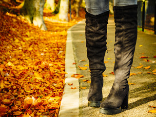 Woman wearing black knee high boots