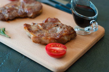 Grilled veal, beef or pork steaks, tomato and soy sauce for meat