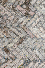 Old brick floor made of bricks of different sizes in the antique Italian city of Antica Ostia