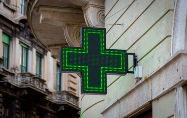 Pharmacy symbol in an urban environment