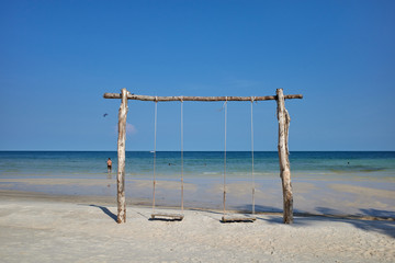 Phu Quoc island, Vietnam - March 27, 2019: Swing on Sao beach, in front of the ocean