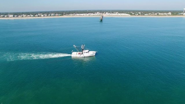 Aerial Point of Interest Shot of a Beautiful Trawling Shrimp Boat off the Carolina Coast