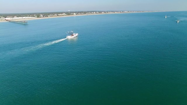 A White Trawling Shrimp Boat, Aerial Shot Approaching the Fishing Vessel, Cinematic Fly-in