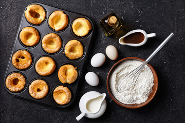 Yorkshire puddings in a metal baking tray