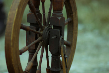 Old vintage antique peasant retro spinning wheel for weaving craft thread making