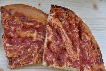 Italian Focaccia With Tomatoes on Wooden Table