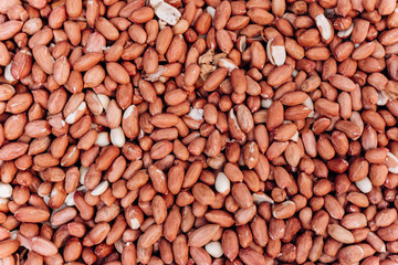 Closeup image of salted peanuts as a food background