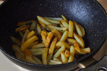 fried potatoes in a frying pan