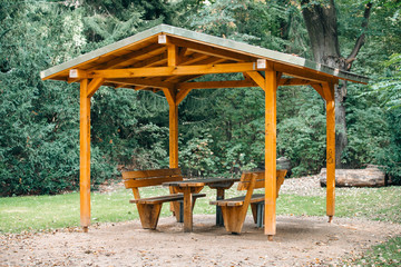 Covered seating area. Gazebo, pergola in parks and gardens - relax and unwind. Wooden gazebo in the...
