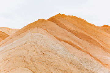 Construction sand mound quarry. A large sand mound in the mines.