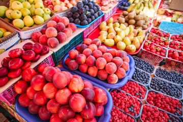 Fresh, juicy fruits at a market under the open sky