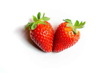2 isolated on white heart shaped strawberry healty fruit concept
