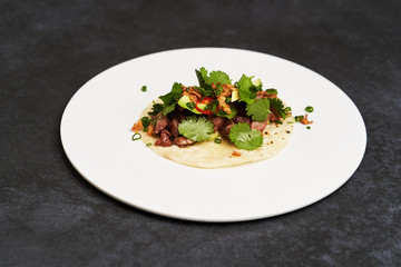 Mexican tacos with beef, tomatoes, avocado, chilli and onion