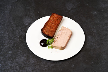 Fototapeta na wymiar Chicken liver pate with blackcurrant,fig sauce and toasted bread