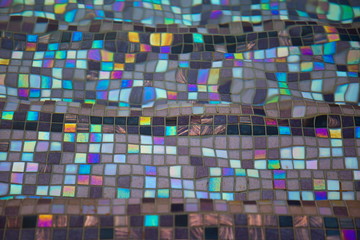 abstract stained colorful and rainbow glass on the floors in swimming pool .