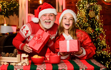 Obraz na płótnie Canvas Believe in Santa Claus. Santa bring gifts little girl. Child enjoy christmas with bearded grandfather Santa claus. Happiness and joy. Cheerful celebration. Festive tradition. Santa Claus exists