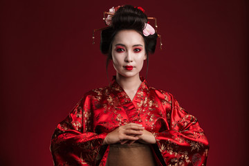 Image of beautiful young geisha woman in traditional japanese kimono - obrazy, fototapety, plakaty