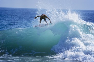 Fototapeta na wymiar Man Surfing On Ocean Wave
