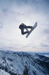 Naklejka na ściany i meble Person On Snowboard Jumping Midair