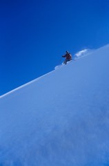 Person Skiing Down Slope