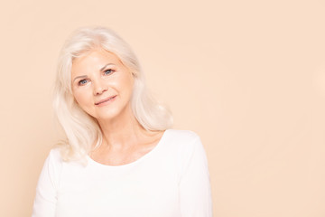 Smiling senior lady looking at camera.