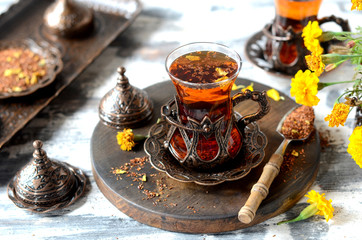 Turkish traditional tea on a white wooden background