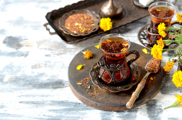 Turkish traditional tea on a white wooden background