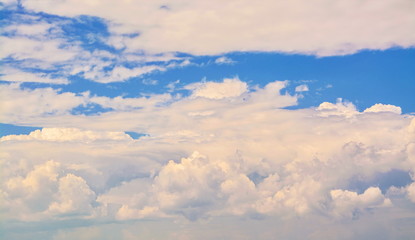 Blue sky with white, fluffy cumulus clouds