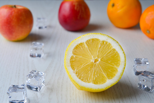 Lemons with the bottom of oranges and apples