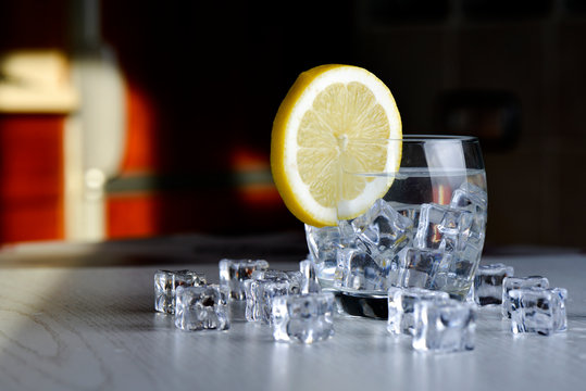 Glass with ice and slice of lemon