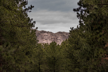 Mount Rushmore through the trees 