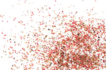 Colorful ground mixed pepper grains, flakes isolated on white background, top view