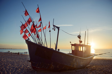 fisherman boats at sunrise time on the beach