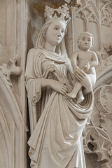 Ancient statue symbolizing motherhood, Maria and Chris and Christmas in interior of the main Catholic Cathedral in Magdeburg, Germany, details, closeup