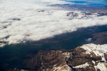Mount Snow clouds landscape from an airplane in the sky