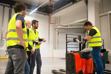 Training on a forklift, managers and workers	