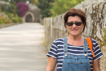 Mature age brunette woman with a cowboy bib