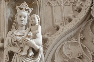 Ancient statue symbolizing motherhood, Maria and Chris and Christmas in interior of the main Catholic Cathedral in Magdeburg, Germany, details, closeup