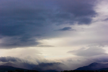 Fototapeta na wymiar Striking view of heavy precipitation over the Snowdonia Mountain range