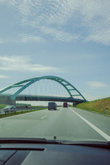 Obraz premium Car view over the steel bridge