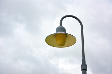 lamp post,Decorative street lamp-post,Retro street lamp shining at night against cloudy sky,Round lamp on pole, outdoor lighting on clear blue sky,street lamp.