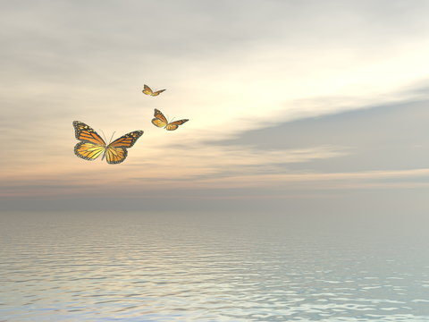 Three monarch butterflies flying upon the ocean - 3D render